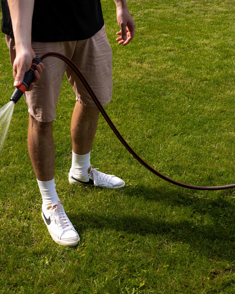 A lawn care professional treating a Florida residential lawn.